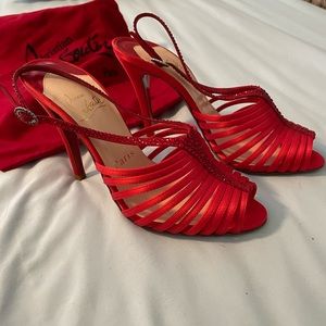 Christian Louboutin heels. Red satin with crystals. Never worn
